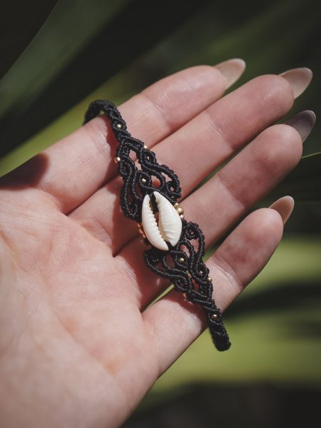 black bracelet with a shell