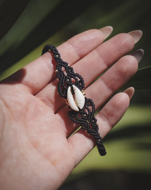 black bracelet with a shell